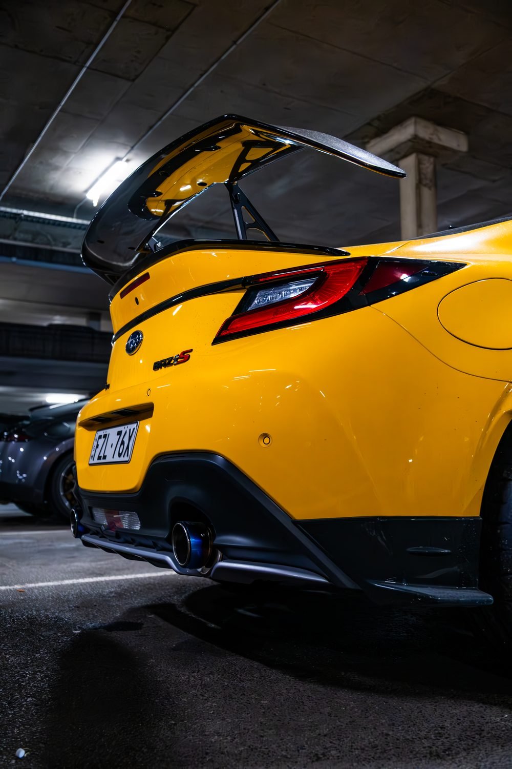 Ferraris, imports and modified cars under carpark lighting at a late-night Sydney car meet (frame 5 of 40)