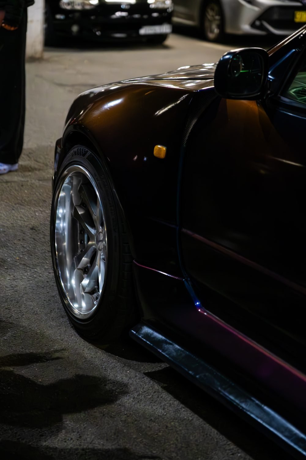 Ferraris, imports and modified cars under carpark lighting at a late-night Sydney car meet (frame 8 of 40)