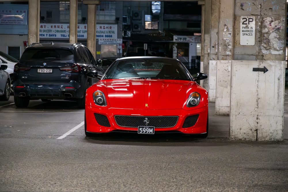 Ferraris, imports and modified cars under carpark lighting at a late-night Sydney car meet (frame 17 of 40)