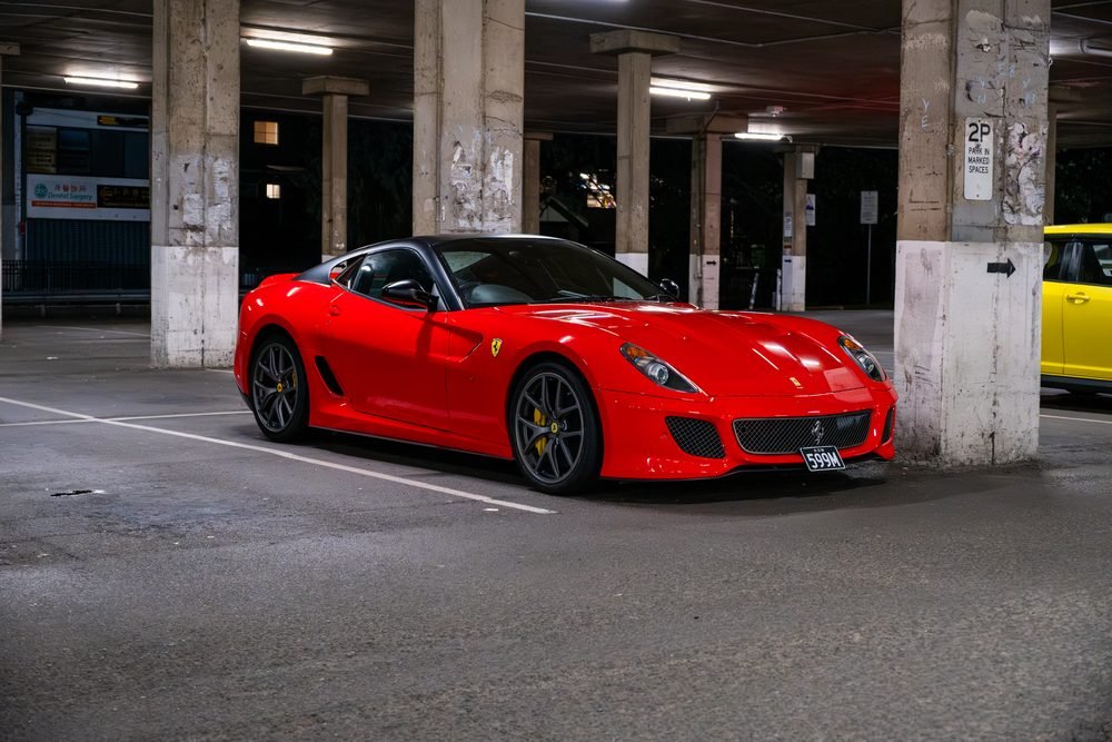 Ferraris, imports and modified cars under carpark lighting at a late-night Sydney car meet (frame 18 of 40)