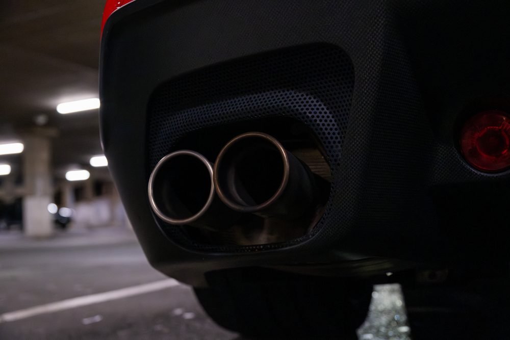 Ferraris, imports and modified cars under carpark lighting at a late-night Sydney car meet (frame 21 of 40)