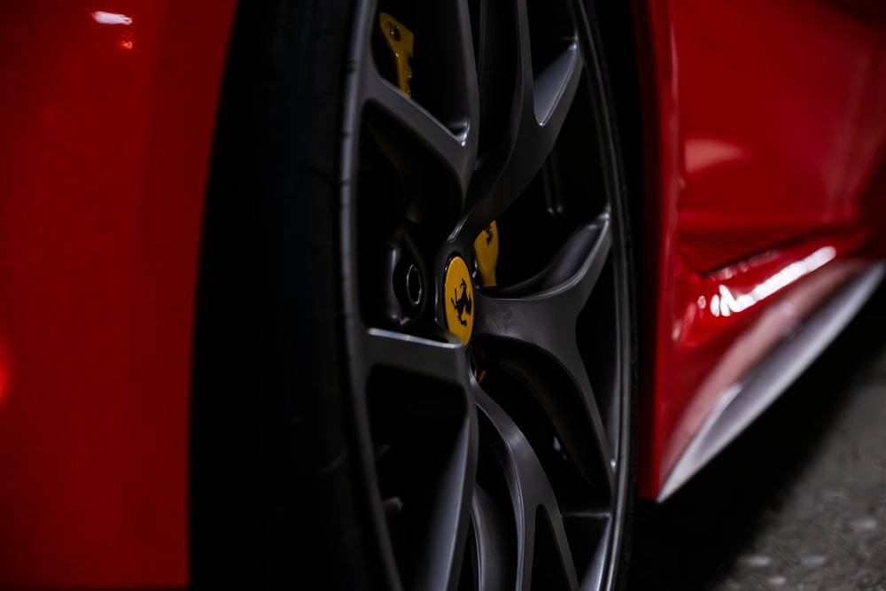 Ferraris, imports and modified cars under carpark lighting at a late-night Sydney car meet (frame 23 of 40)