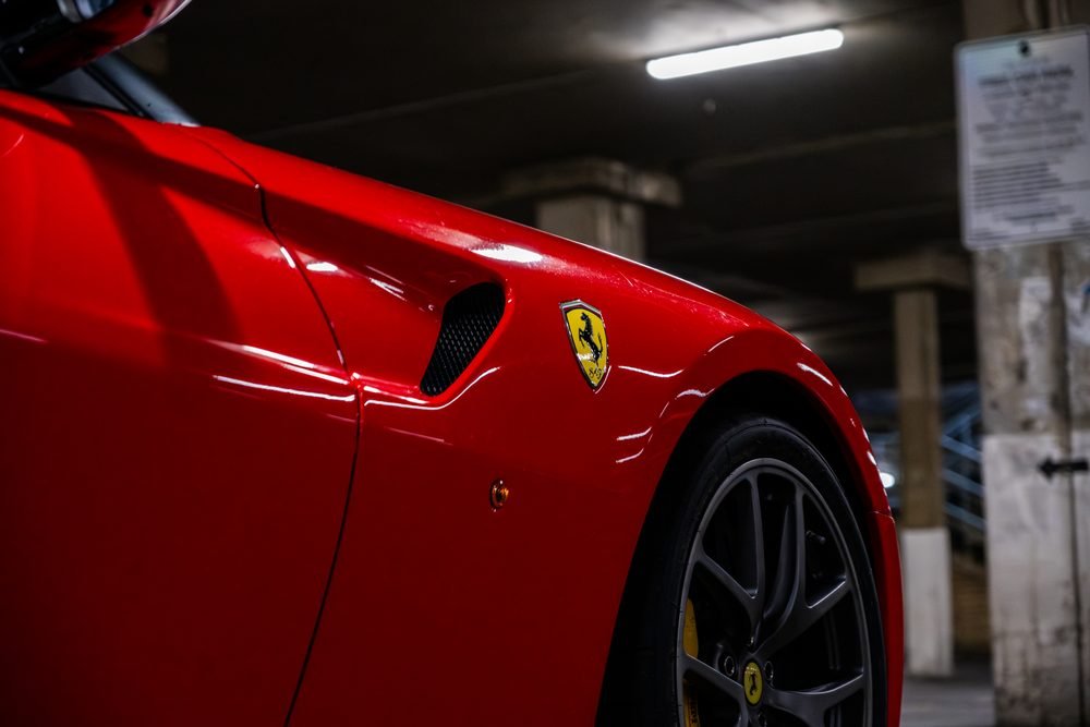 Ferraris, imports and modified cars under carpark lighting at a late-night Sydney car meet (frame 24 of 40)