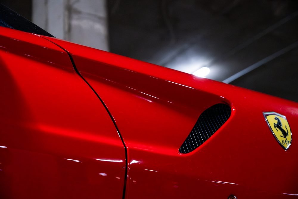 Ferraris, imports and modified cars under carpark lighting at a late-night Sydney car meet (frame 26 of 40)