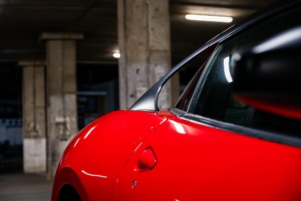 Ferraris, imports and modified cars under carpark lighting at a late-night Sydney car meet (frame 27 of 40)
