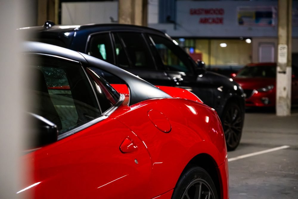 Ferraris, imports and modified cars under carpark lighting at a late-night Sydney car meet (frame 29 of 40)