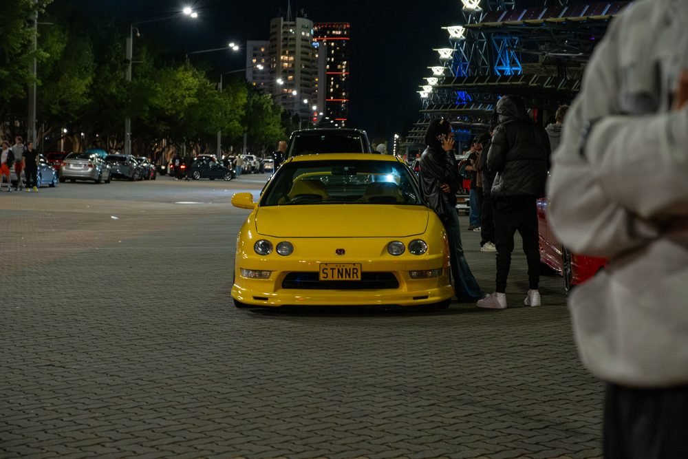 Ferraris, imports and modified cars under carpark lighting at a late-night Sydney car meet (frame 37 of 40)