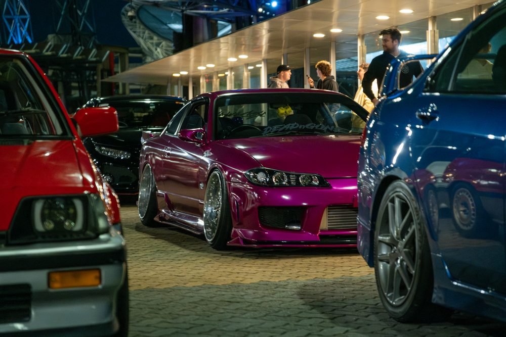 Ferraris, imports and modified cars under carpark lighting at a late-night Sydney car meet (frame 38 of 40)