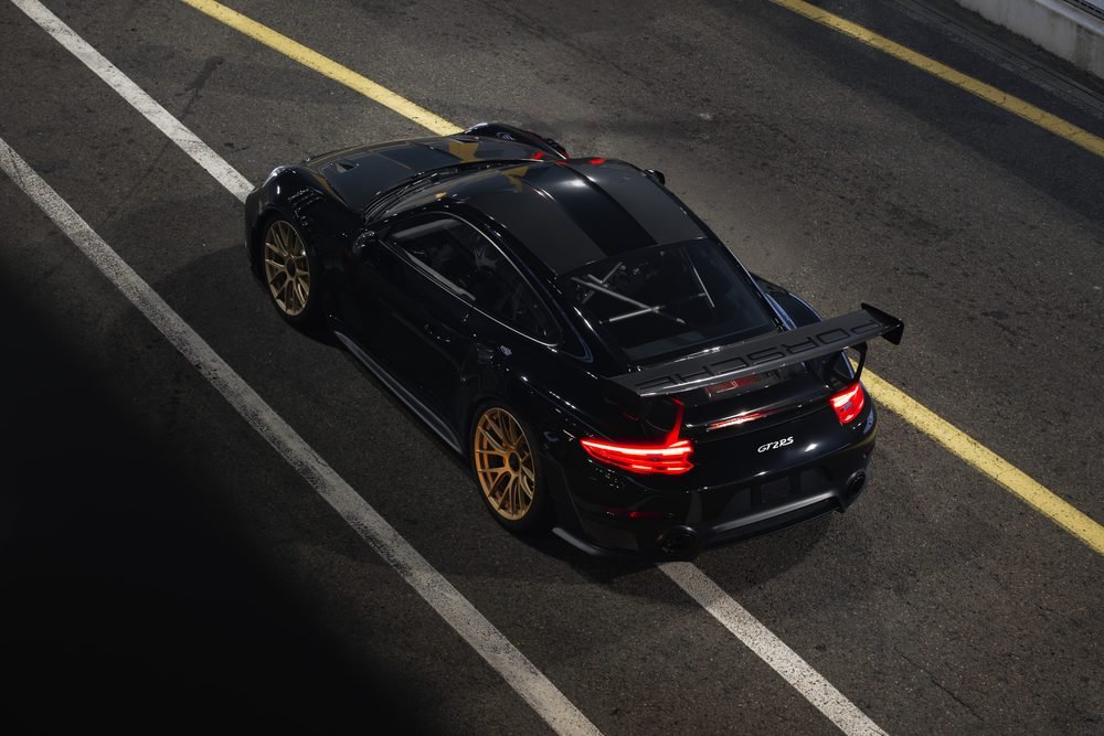 Track car under floodlights at Sydney Motorsport Park at night