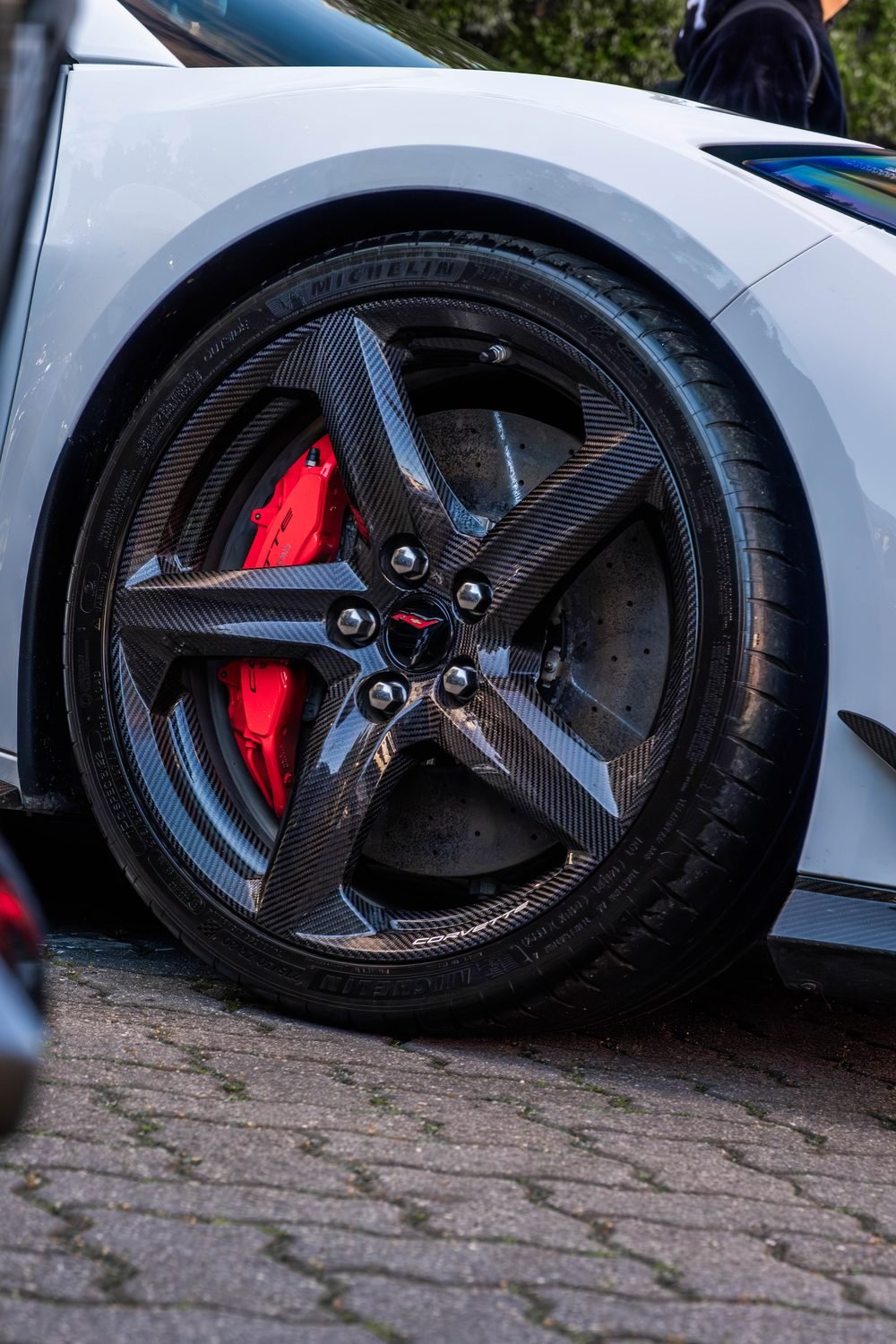 Carbon fibre wheel and red brake caliper on a Chevrolet Corvette Z06