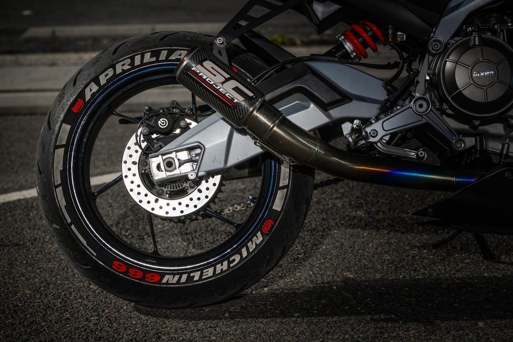 Sportbike photographed from dusk into full dark against Sydney's working harbour (frame 2 of 8)