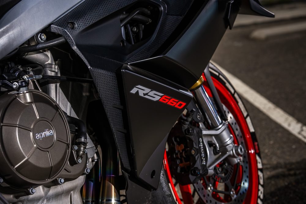 Sportbike photographed from dusk into full dark against Sydney's working harbour (frame 3 of 8)