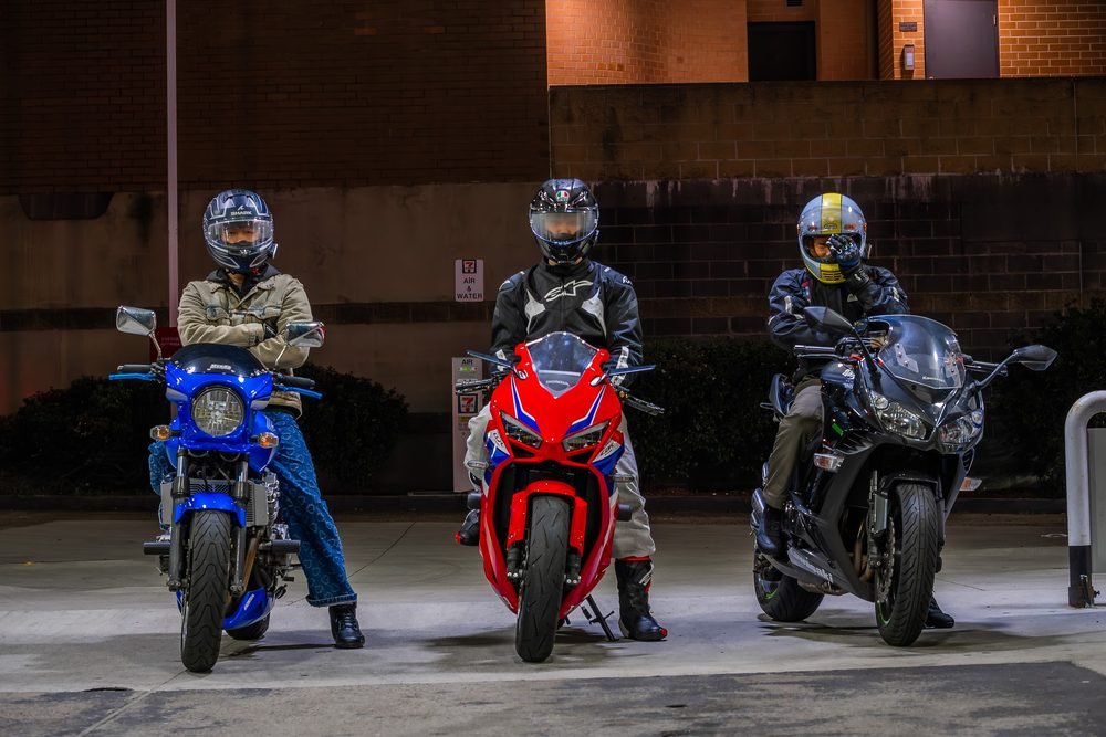 Sportbike photographed from dusk into full dark against Sydney's working harbour (frame 7 of 8)