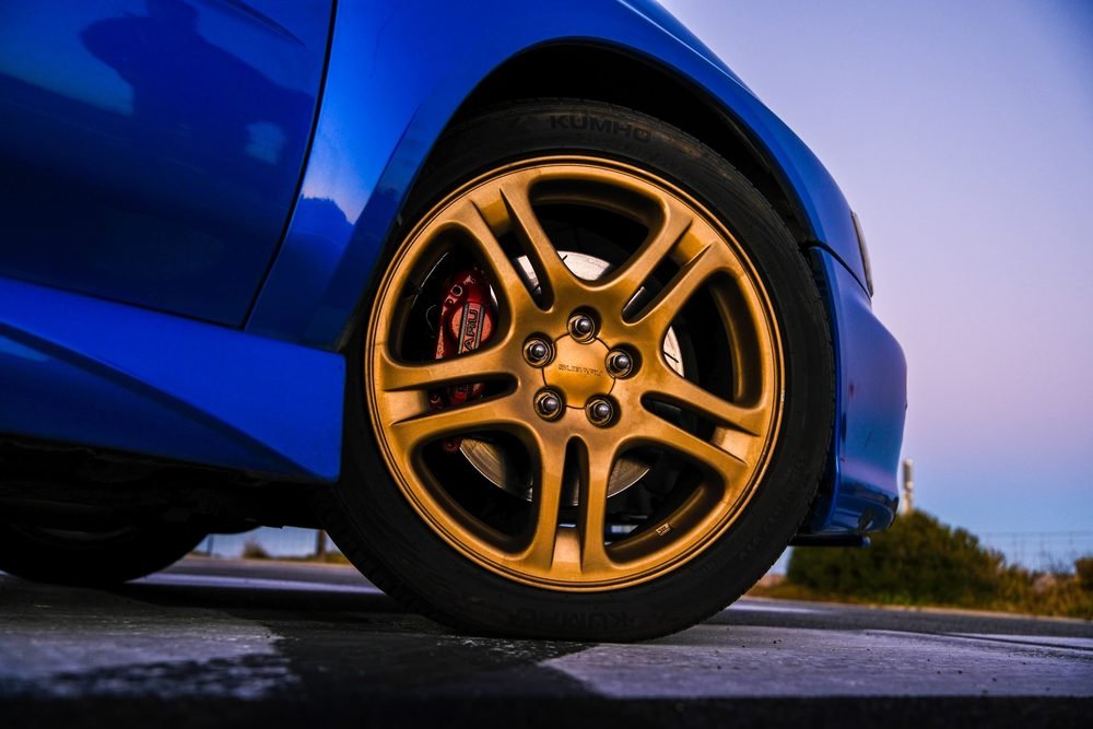 Subaru Impreza WRX STI on gold wheels at a New South Wales coastal lookout during blue hour (frame 6 of 12)