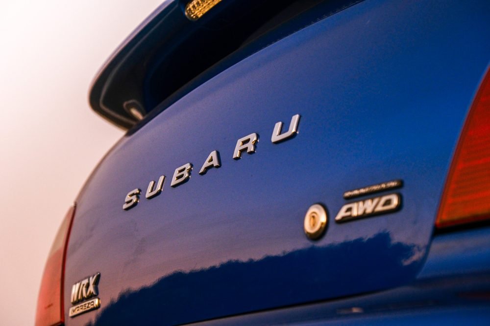 Subaru Impreza WRX STI on gold wheels at a New South Wales coastal lookout during blue hour (frame 7 of 12)