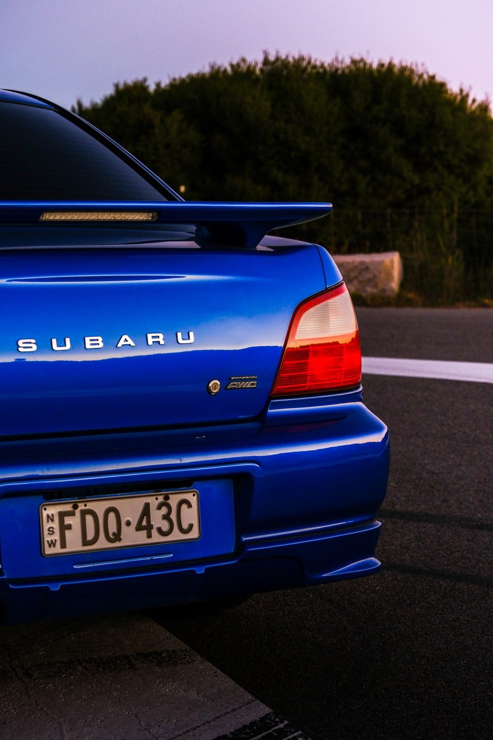 Subaru Impreza WRX STI on gold wheels at a New South Wales coastal lookout during blue hour (frame 8 of 12)
