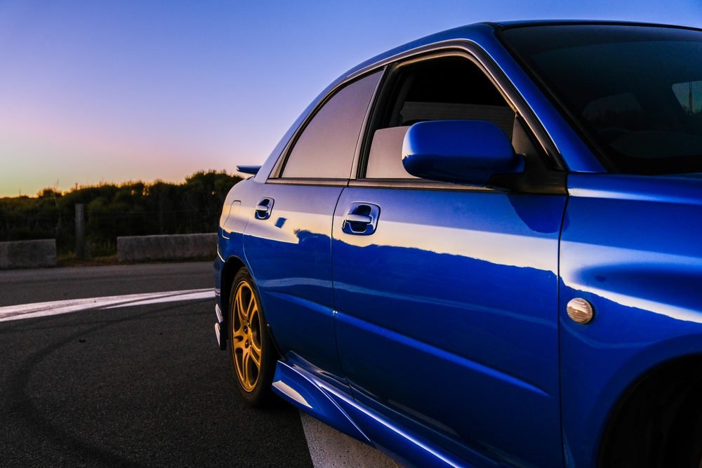 Subaru Impreza WRX STI on gold wheels at a New South Wales coastal lookout during blue hour (frame 9 of 12)