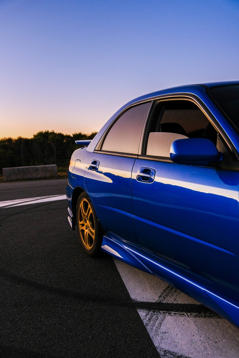 Subaru Impreza WRX STI on gold wheels at a New South Wales coastal lookout during blue hour (frame 10 of 12)