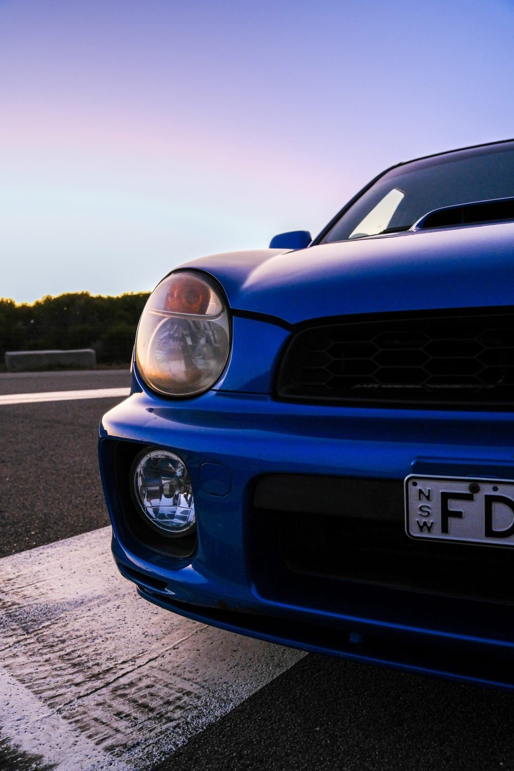 Subaru Impreza WRX STI on gold wheels at a New South Wales coastal lookout during blue hour (frame 11 of 12)