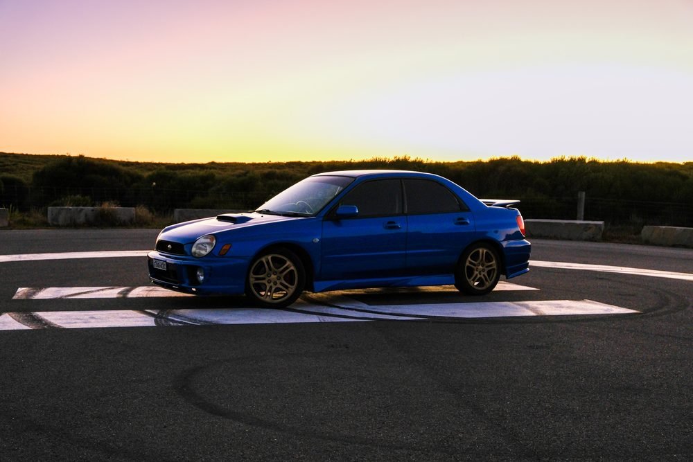 Subaru Impreza WRX STI on gold wheels at a New South Wales coastal lookout during blue hour (frame 12 of 12)